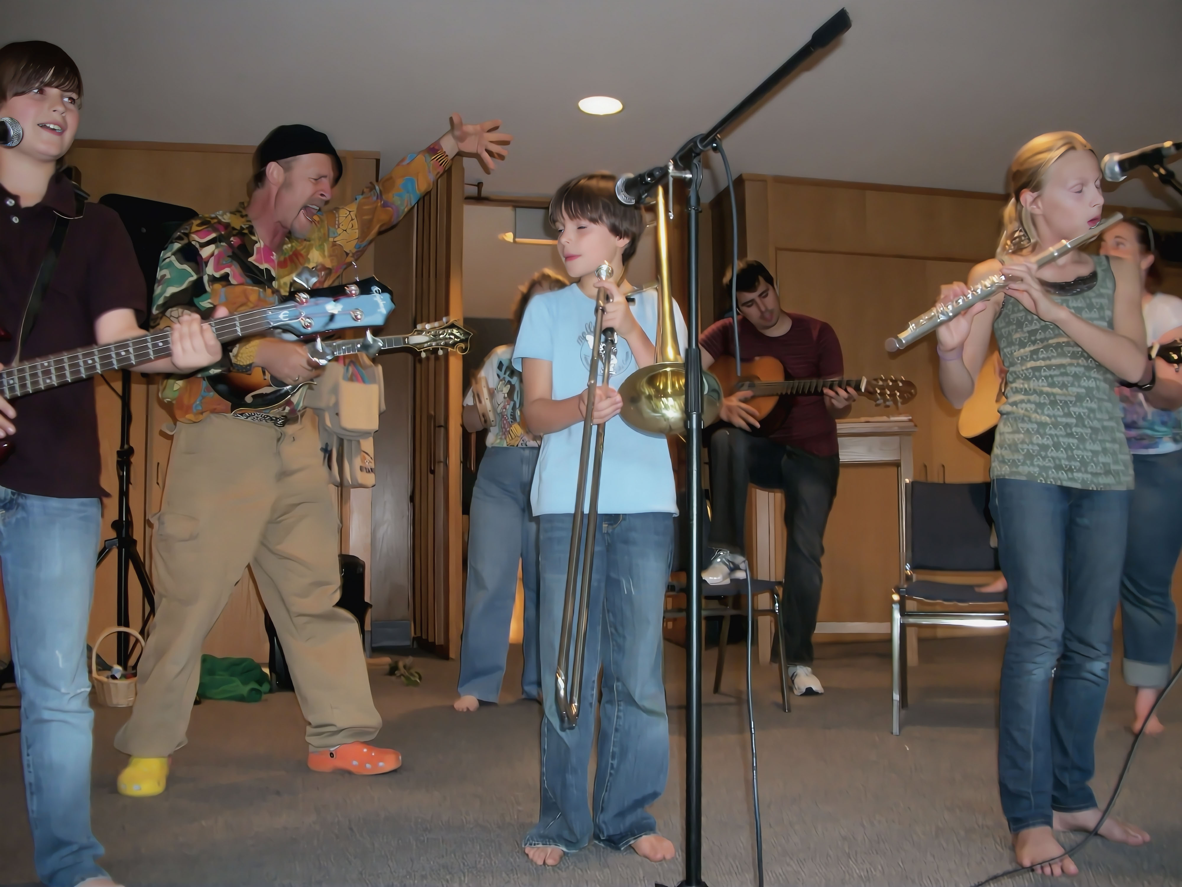 Student locking in a bass groove with a mentor